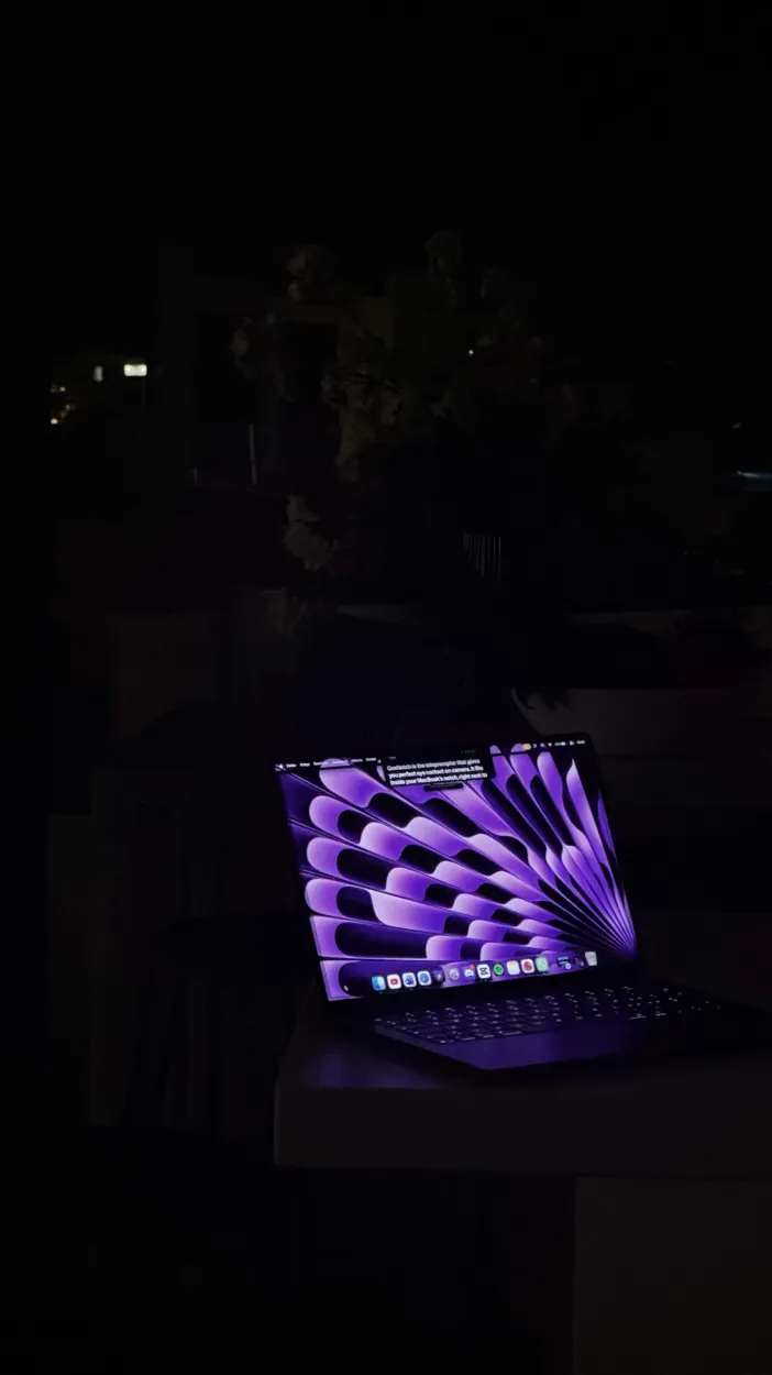 CueNotch teleprompter running beside the camera on a MacBook in a focused workspace