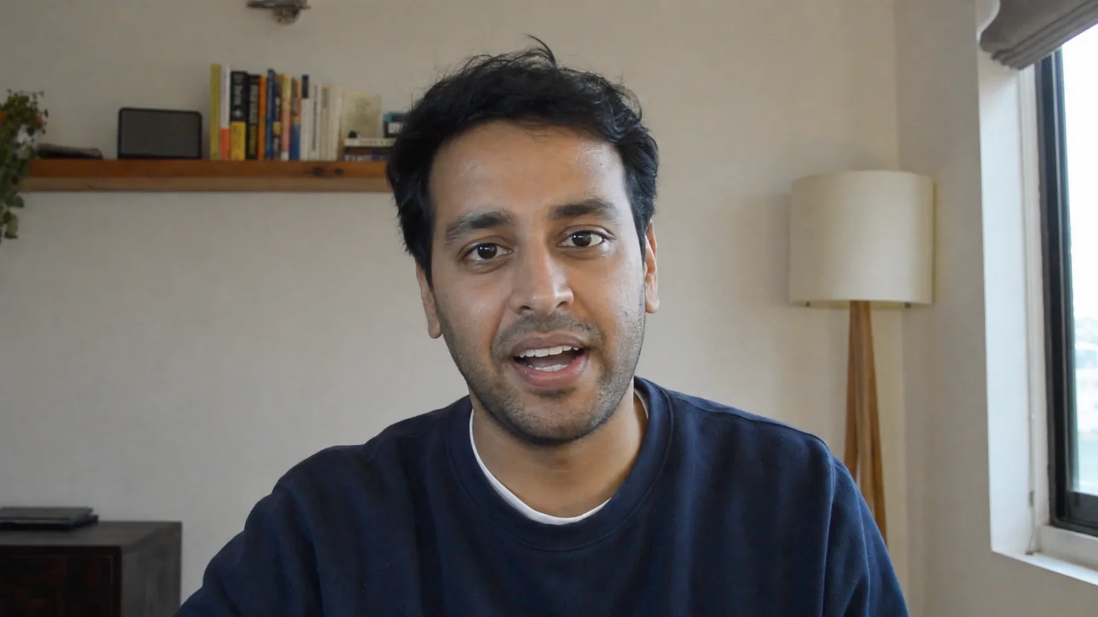 The same man reading from CueNotch, eyes on the camera